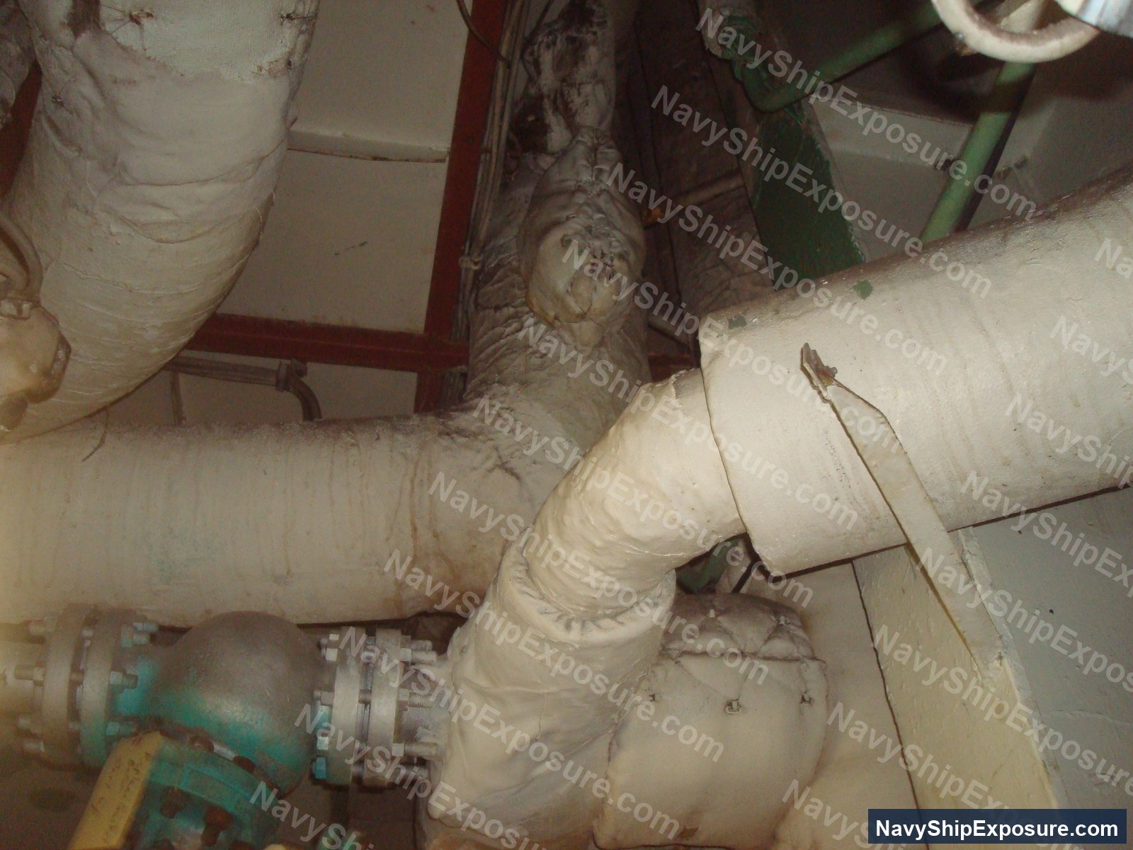 USS Midway — Insulated piping in an engine room or machinery space of USS Midway, showing wrapped thermal insulation typical of naval vessel steam systems from the Cold War era.