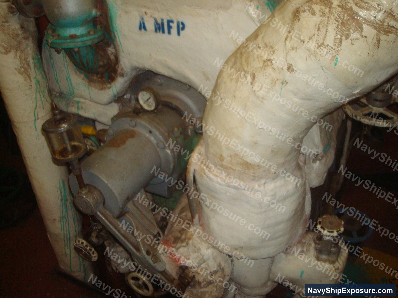 USS Midway — Engine room or machinery space photograph from USS Midway showing insulated piping, valves, gauges, and industrial equipment characteristic of 1940s-era naval propulsion systems.