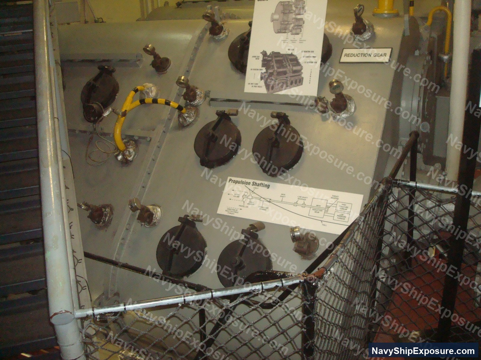 USS Midway — Museum display panel showing propulsion system components including reduction gear, propulsion shafting, and various mechanical assemblies from USS Midway's engineering spaces.