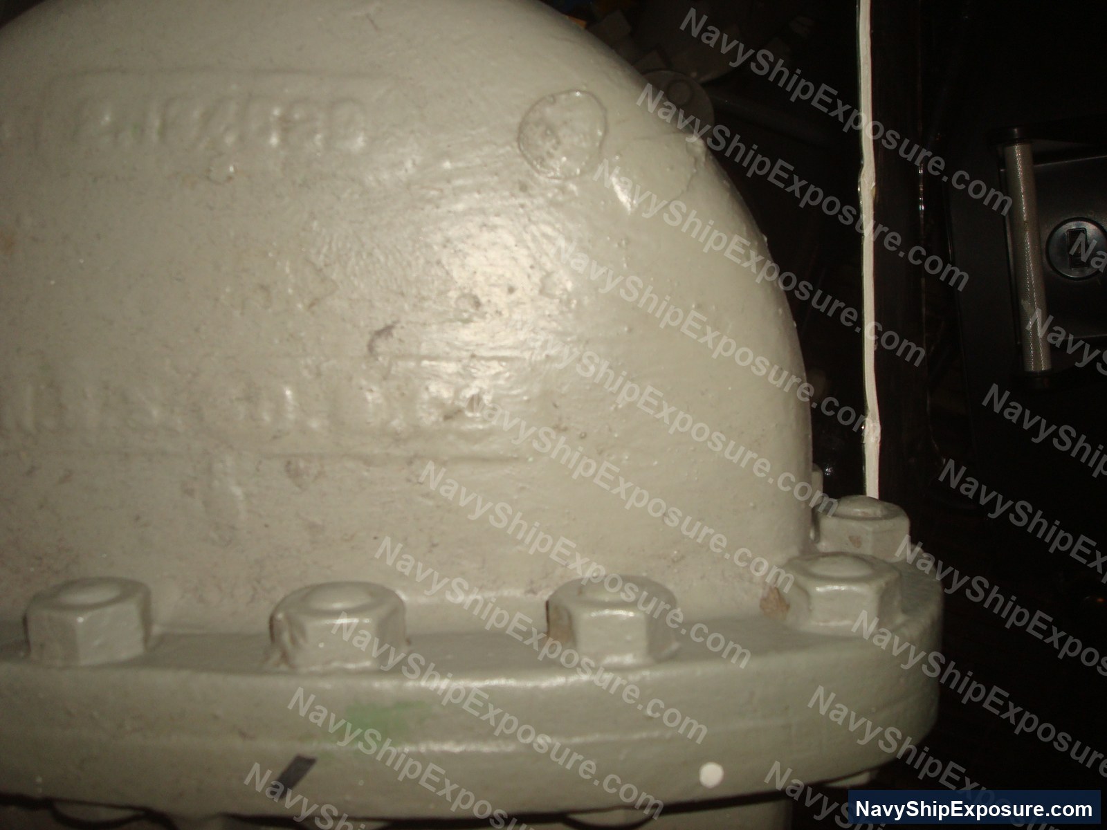 USS Midway — Close-up photograph of an insulated spherical vessel or tank with visible bolted connections and thermal insulation coating, likely from the USS Midway's engineering spaces.