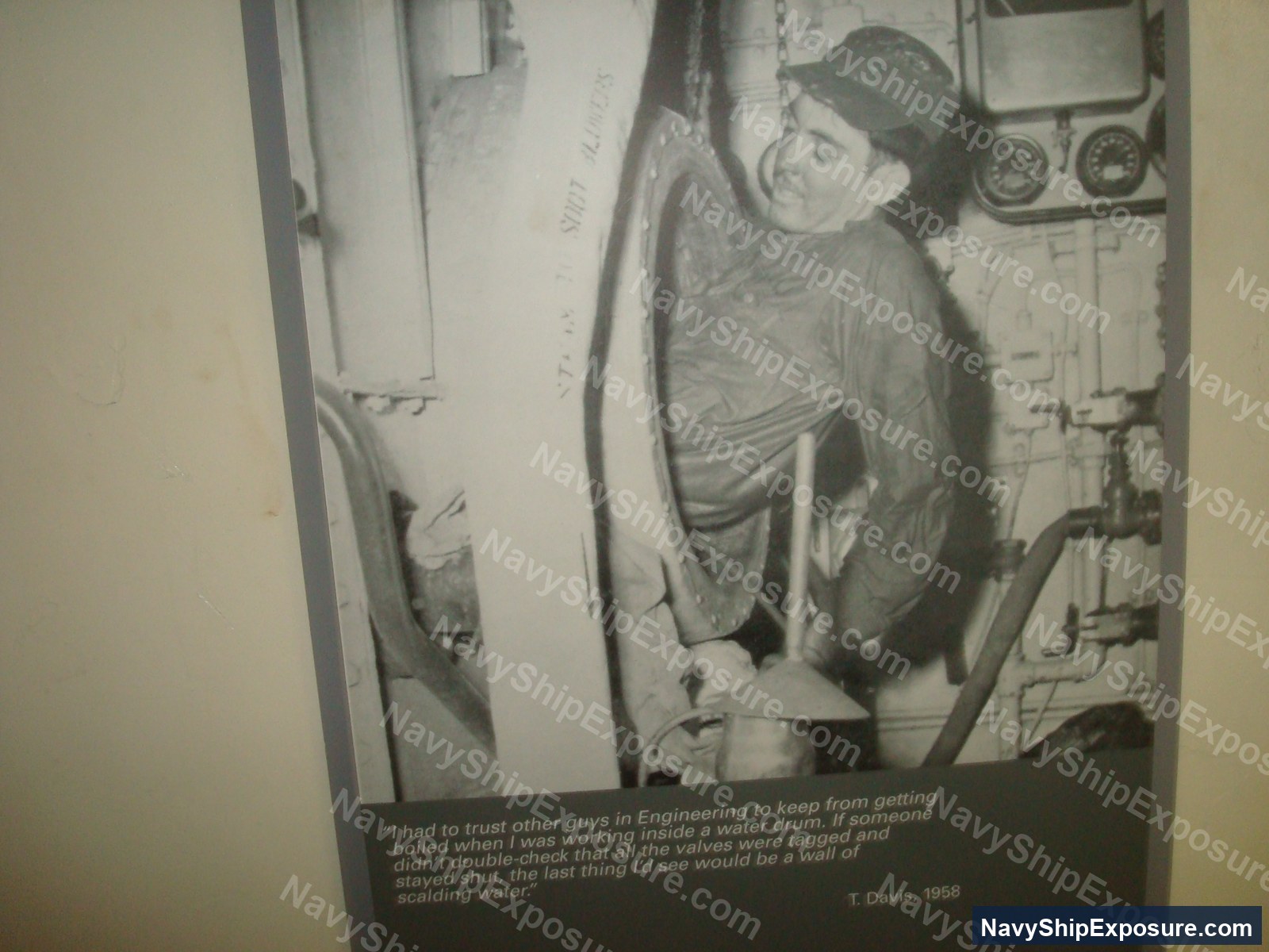 USS Midway — A sailor working inside a water drum in the boiler room of USS Midway in 1958, demonstrating the confined spaces and hazardous conditions where asbestos insulation was commonly present on naval vessels.